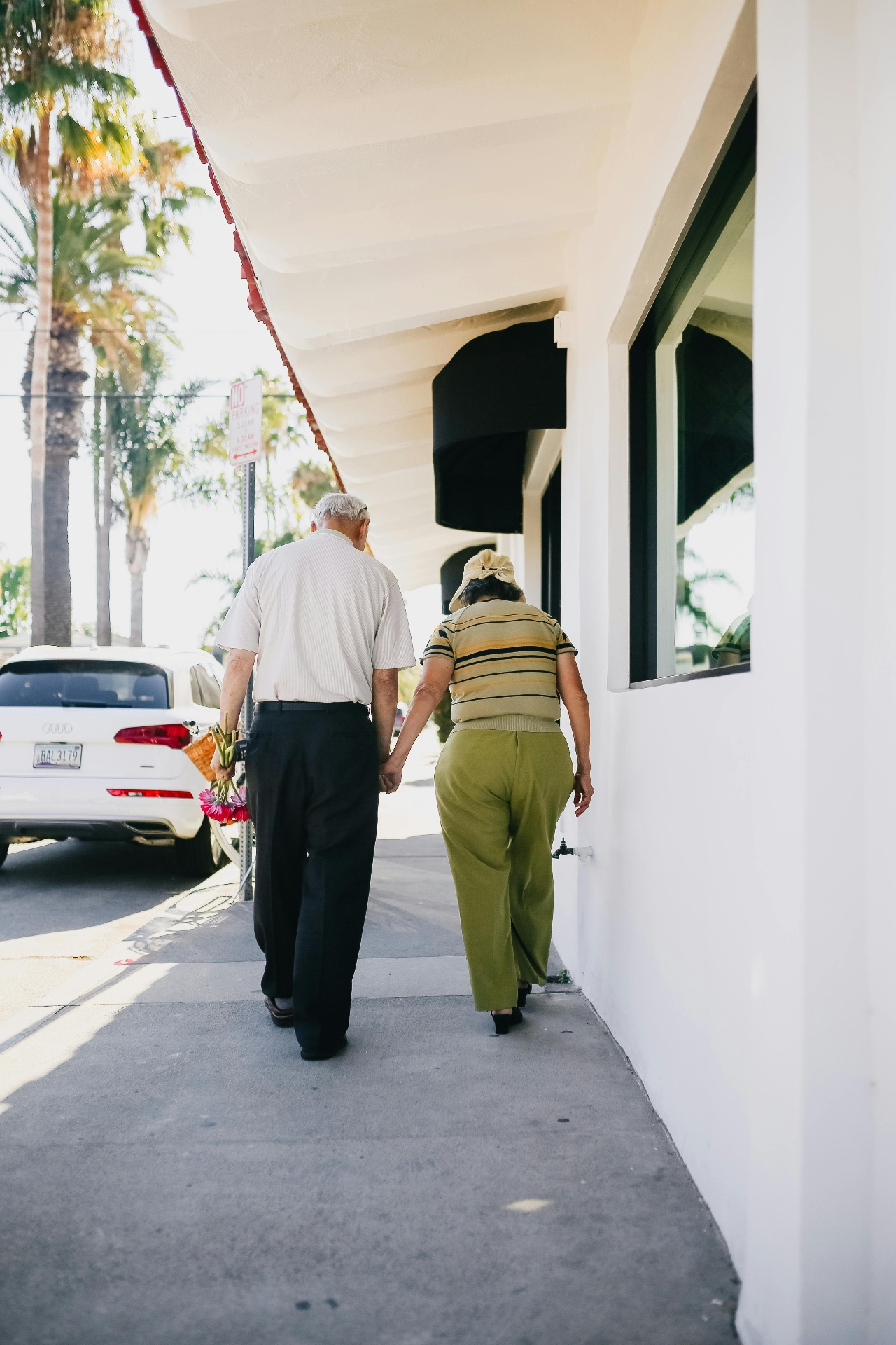 An older couple walking together